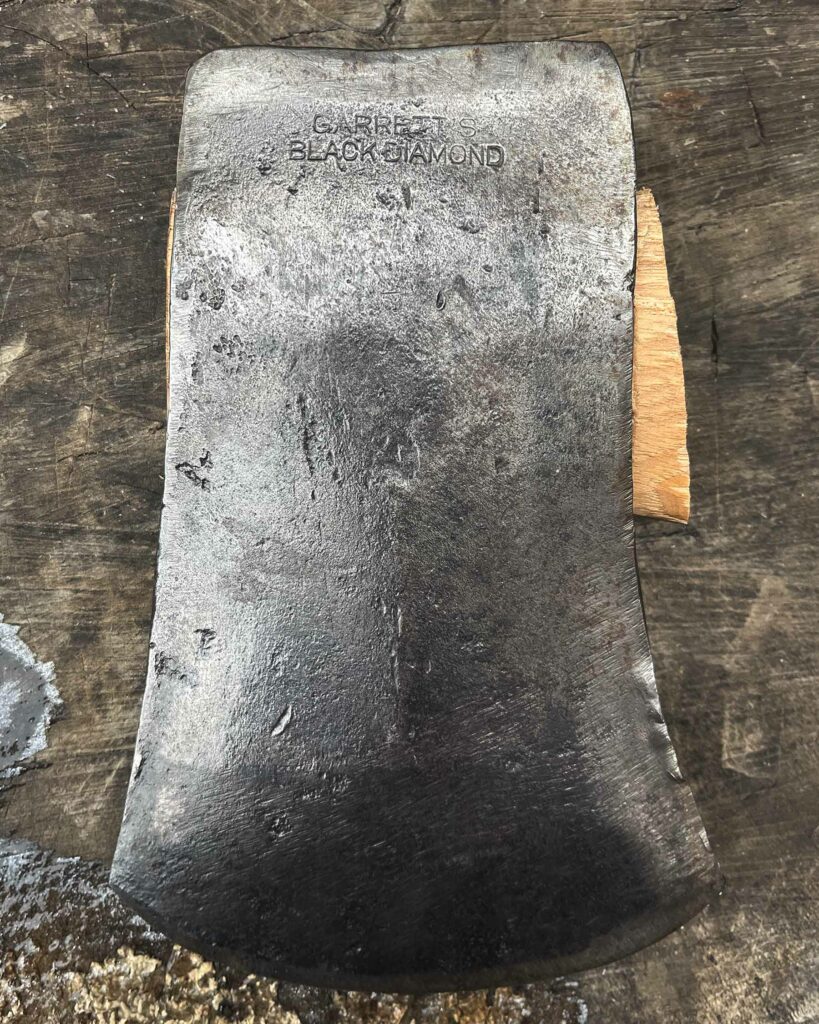 Image of a Garrett's Black Diamond Hand Made Axe with stamped name in the pole