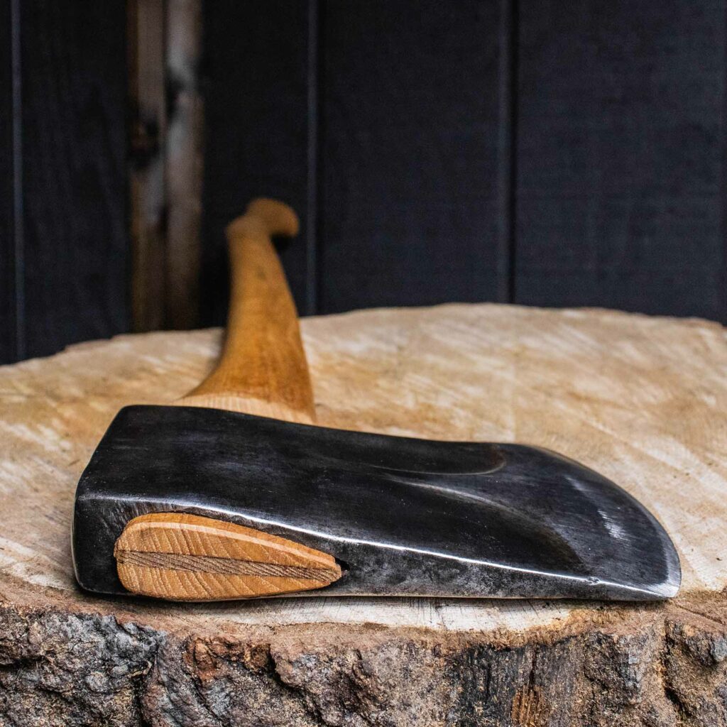 Canadian-Made Kelly Tassie Axe on a log